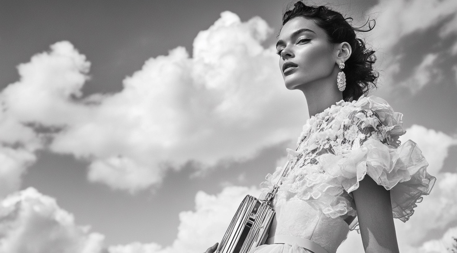 Black fashion silhouette framed by cloud and light